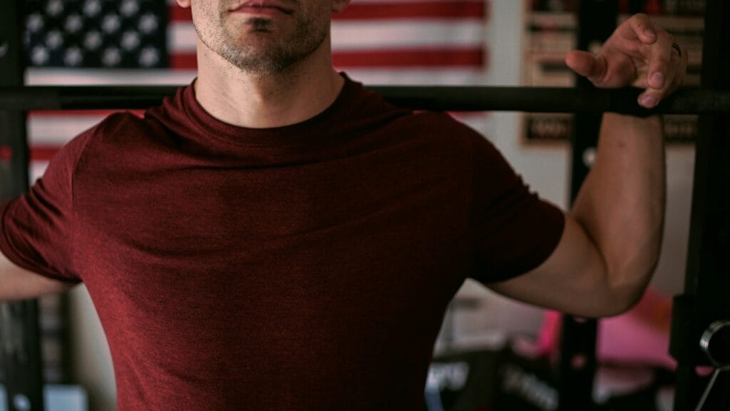 Man lifting heavy weights during strength training – natural way to increase testosterone