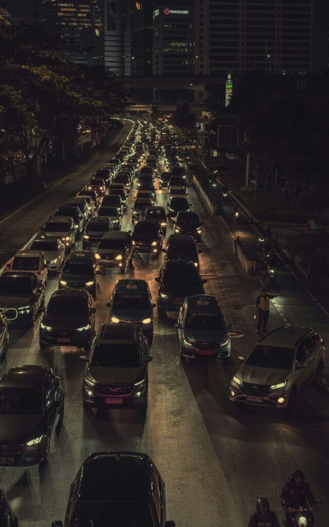 Heavy traffic at night — symbol of daily stress, Overtraining and Testosterone impact beyond the gym
