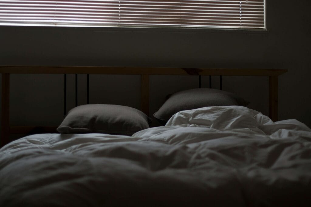 sleeping peacefully in a dark room – quality sleep supports healthy testosterone levels