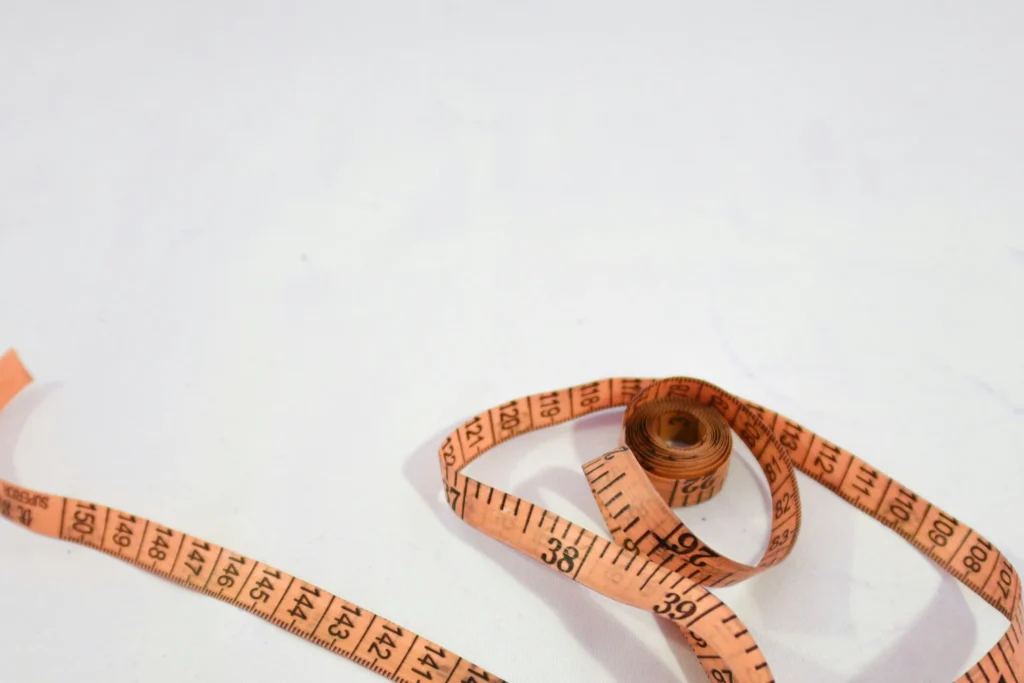 The Rock weight loss concept illustrated by measuring tape