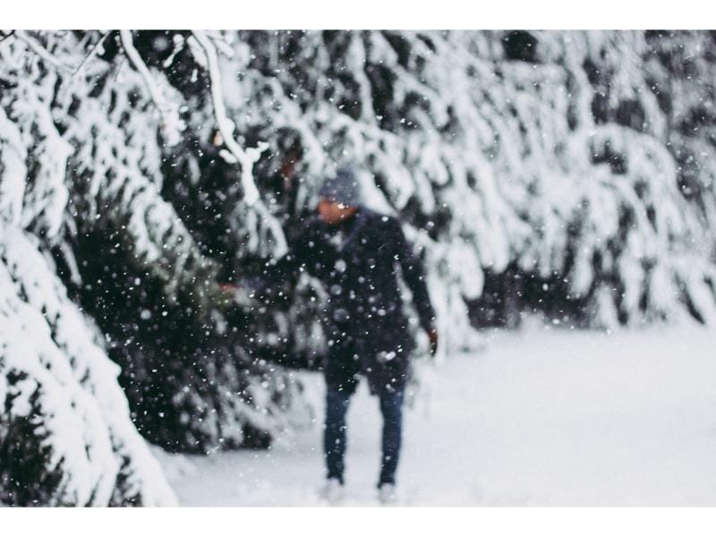cold exposure benefits for men - Man with intense focus emerging from an ice bath.